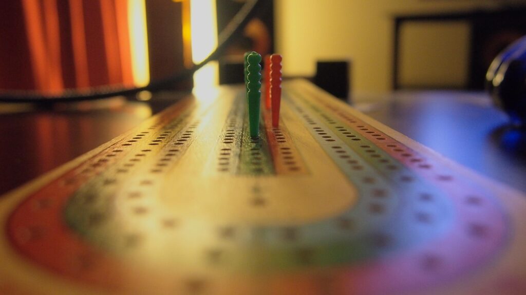 cribbage, game, fun, play, green, red, blue, board, wood, toy, strategy, activity, competition, win, peg, pegs, cards, card, points